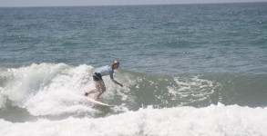 Michelle Waltman surfing at 18th Ave on Pensacola Beach, FL