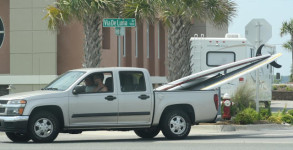 Tourists with too many SUPs in their truck on Pensacola Beach