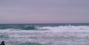 New Years Eve 2012 Midday waves and surfers on Pensacola Beach, FL beside the Fishing Pier